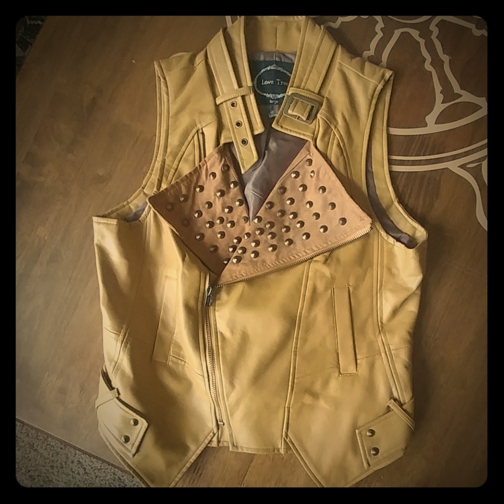 Mustard color faux leather vest.